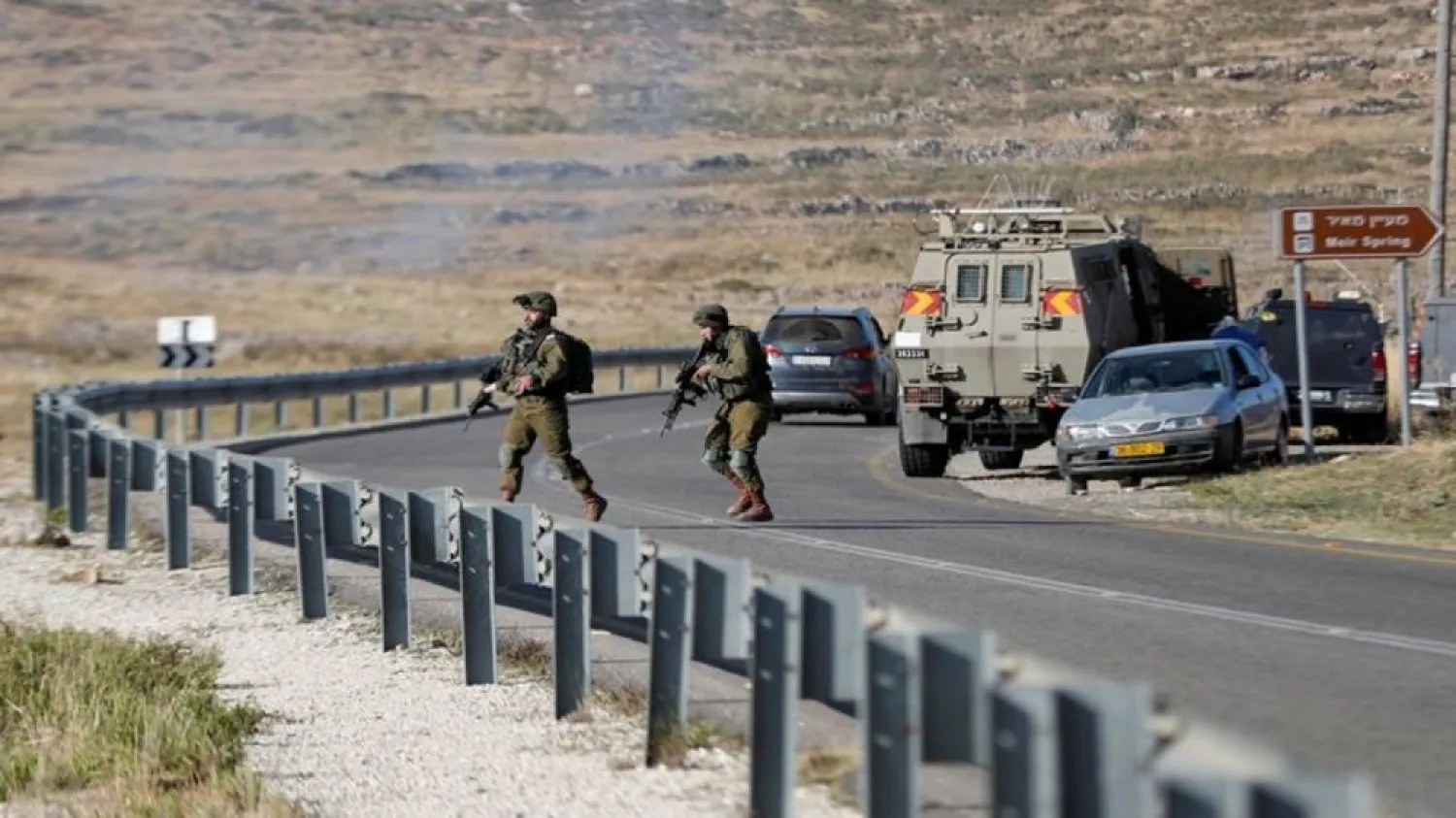Israeli soldiers run near the scene of an incident near Ramallah in the Israeli-occupied West Bank May 29, 2020. (Reuters)