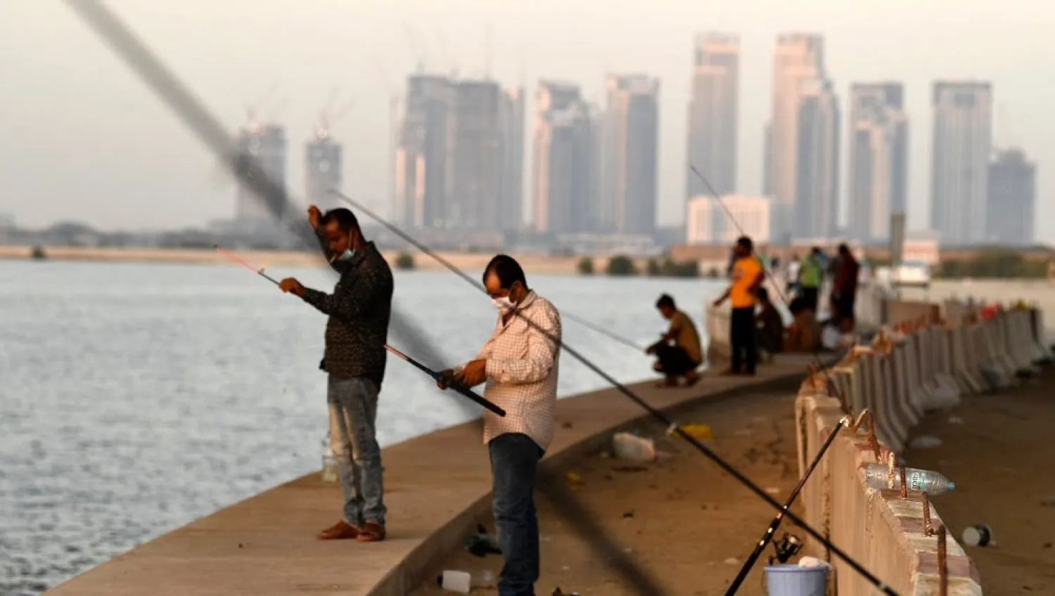 Men gather to fish at the creek in Dubai, after the authorities eased some of the restrictions to stem the spread of the novel coronavirus, on May 27, 2020. (Reuters)