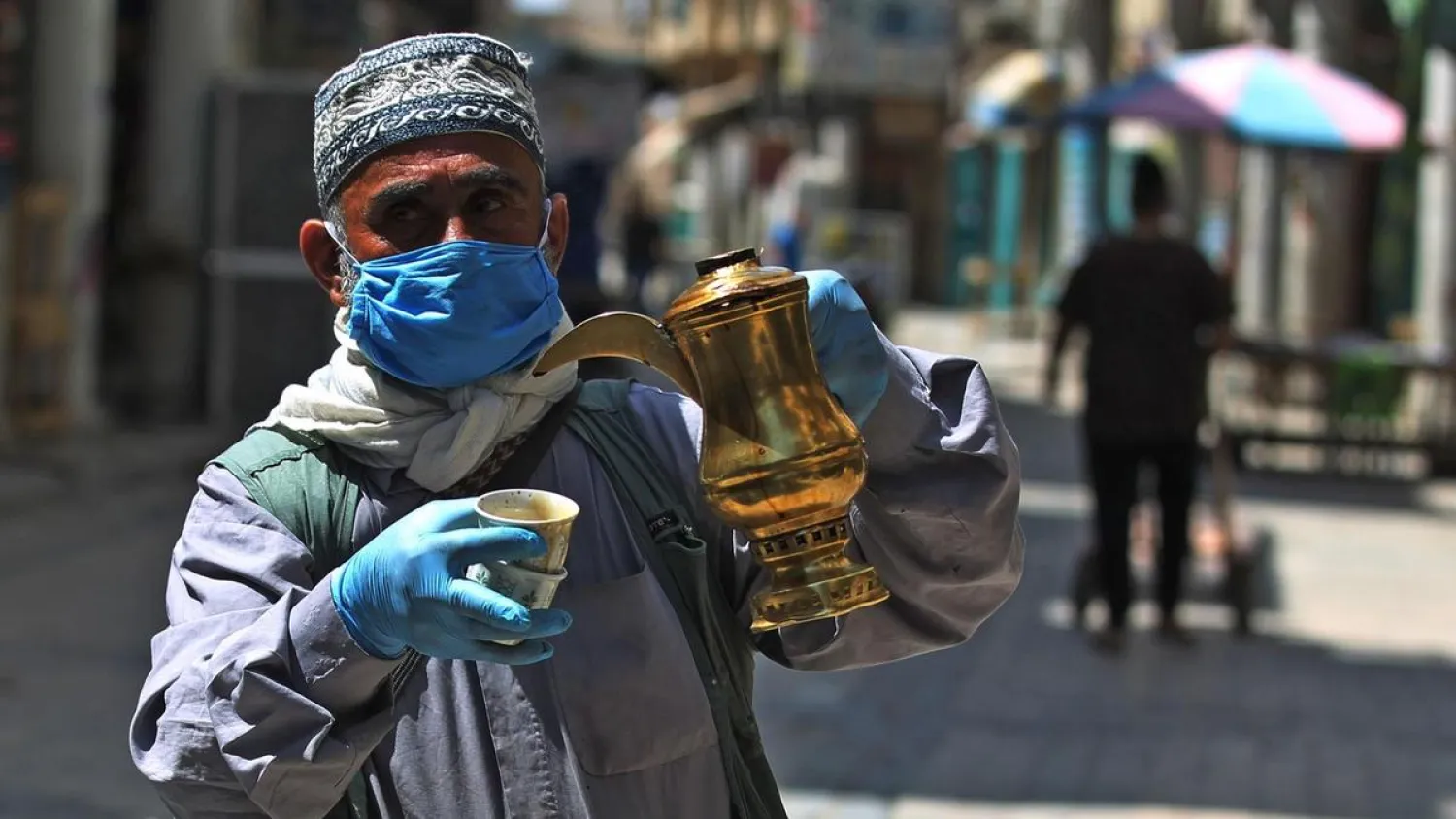 An Iraqi man sells coffee in the capital Baghdad's deserted al-Mutanabbi street. (AFP)