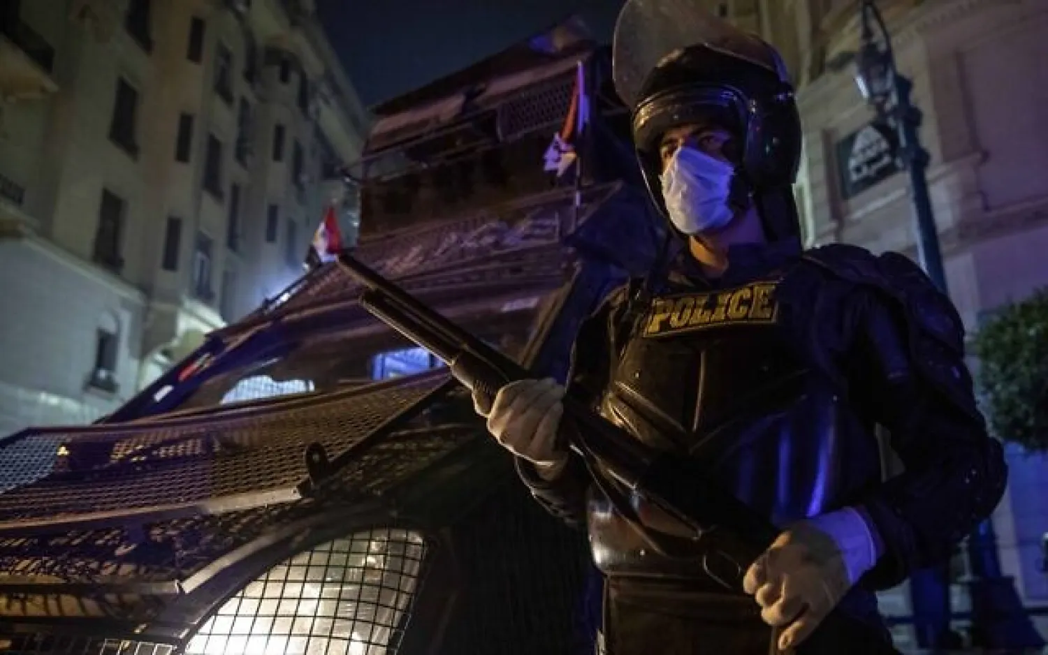 Egyptian security forces cordon off roads during curfew hours as prevention measures due to the coronavirus outbreak, in Cairo, Egypt, March 29, 2020 (AP Photo/Nariman El-Mofty)
