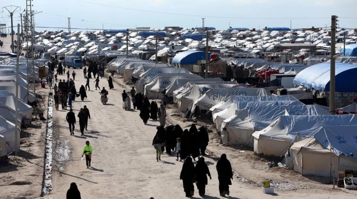 Women walk through al-Hol displacement camp in Hasakah province, Syria, April 1, 2019. Reuters