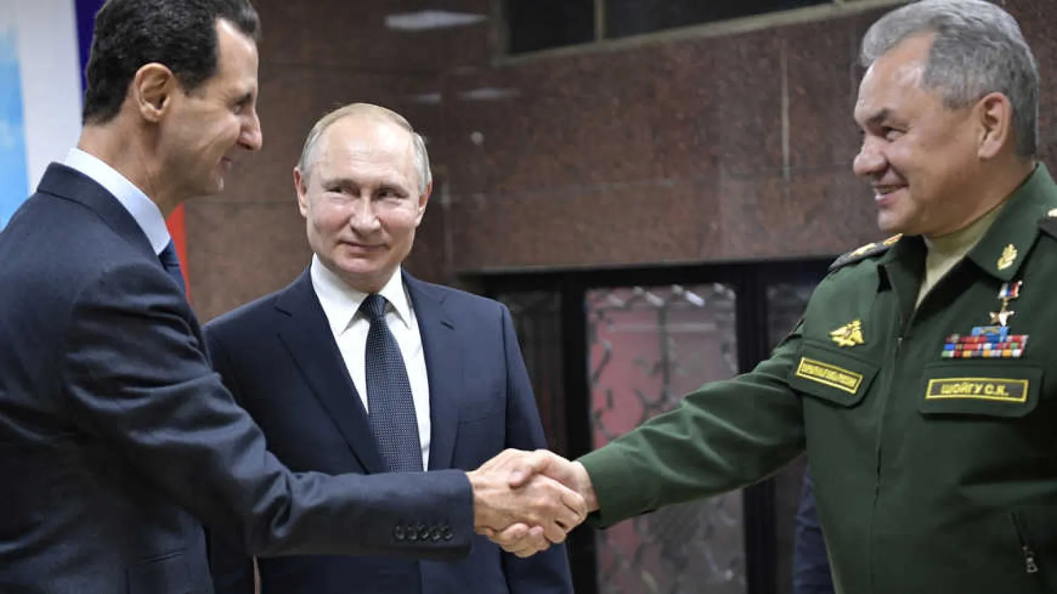 Russian President Vladimir Putin, Defense Minister Sergei Shoigu and Syrian President Bashar al-Assad attend a meeting in Damascus, Syria, Jan. 7, 2020. Photo by Sputnik/Aleksey Nikolskyi/Kremlin via REUTER