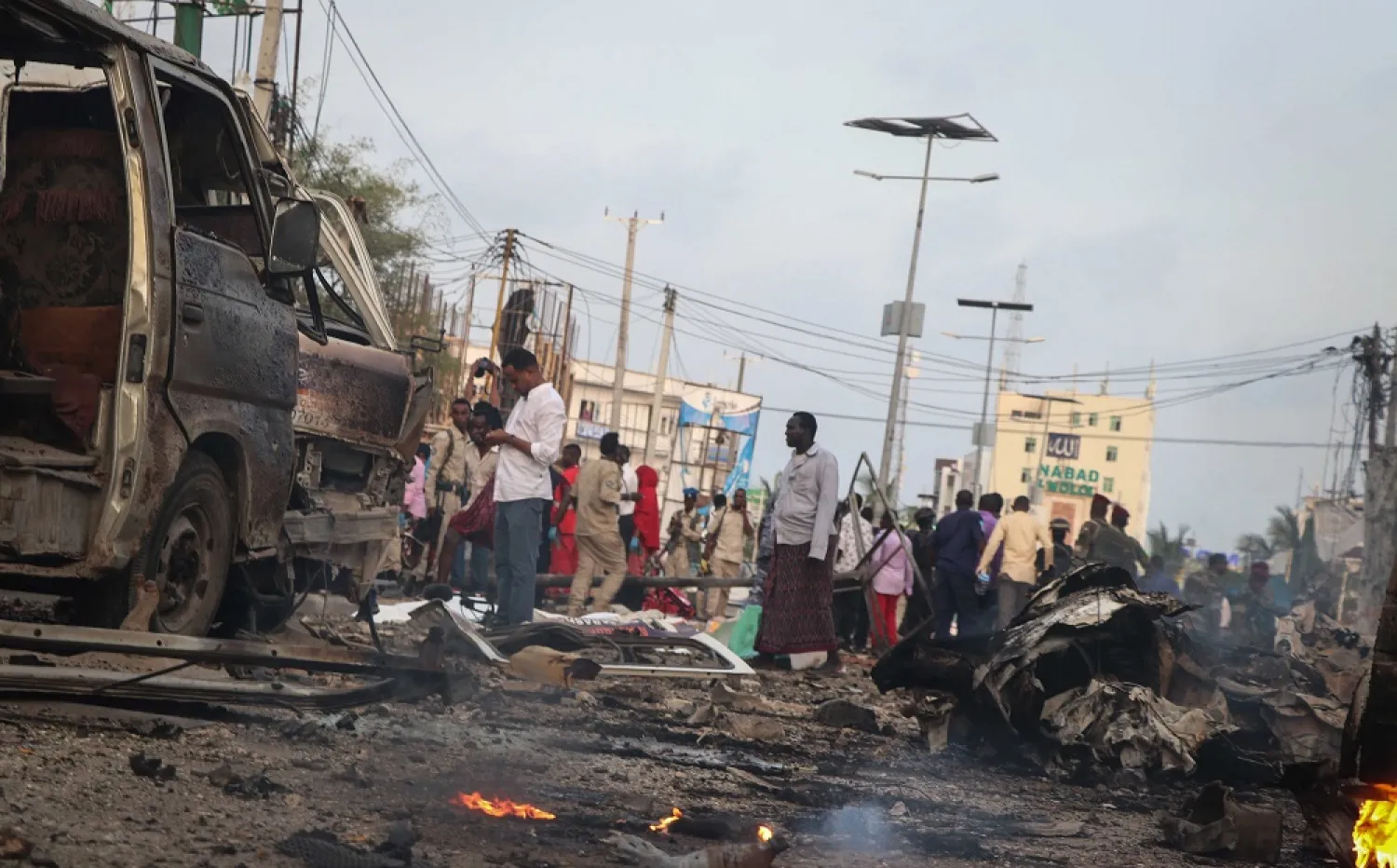 People gather at the scene of twin car bombs that exploded within moments of each other in the Somali capital Mogadishu, Nov. 9, 2018. (AFP)
