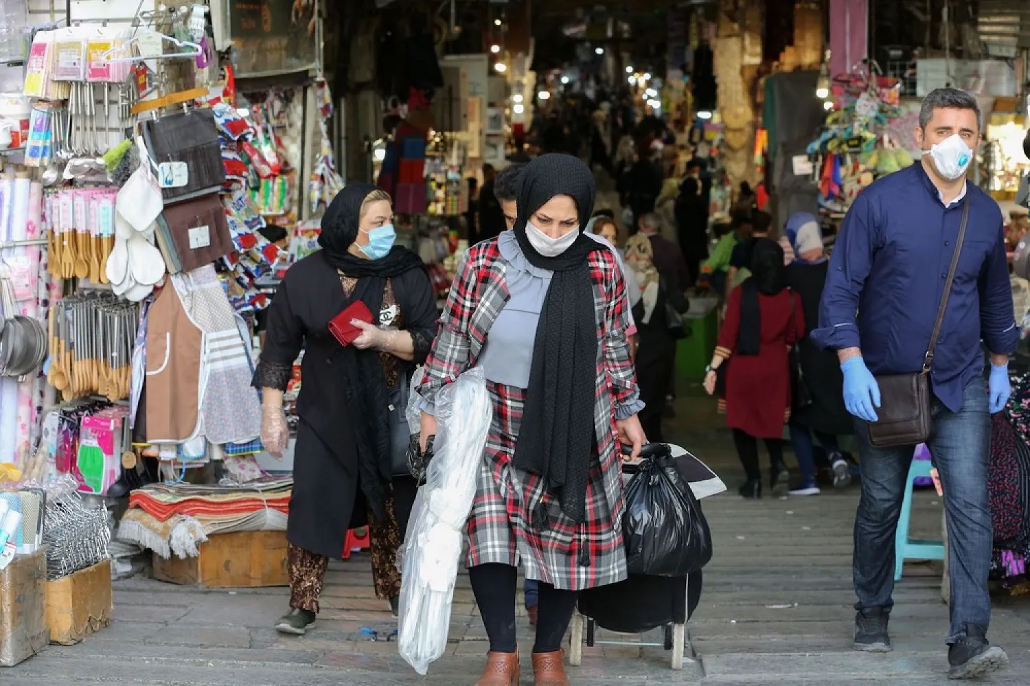 Iranians shop at the Grand Bazaar in Tehran on April 20 amid the COVID-19 pandemic. (Getty Images)