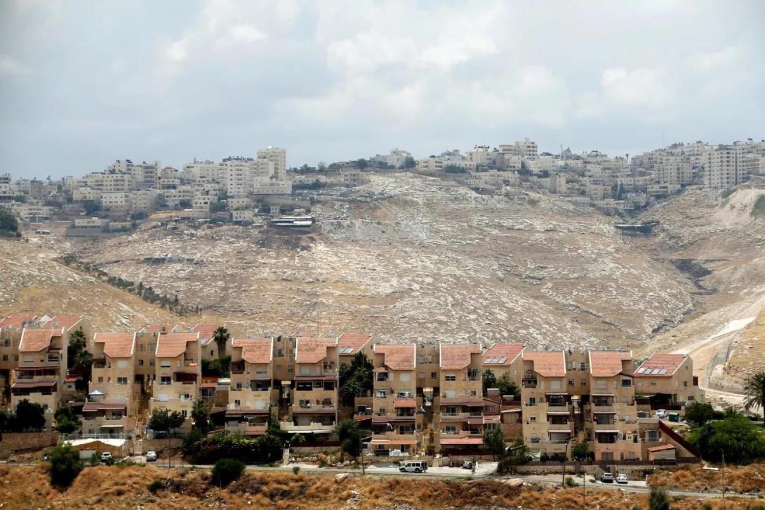 The West Bank Jewish settlement of Maale Adumim, foreground, and the Palestinian village of Al-Eizariya. (Reuters)