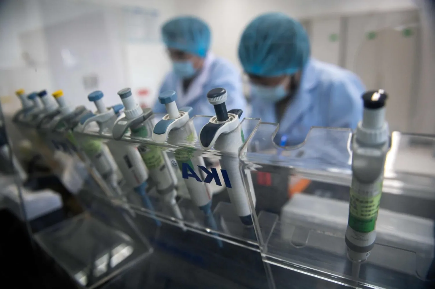 Workers are seen inside the Beijing Applied Biological Technologies (XABT) research and development laboratory, Beijing, May 14, 2020. (AFP Photo)