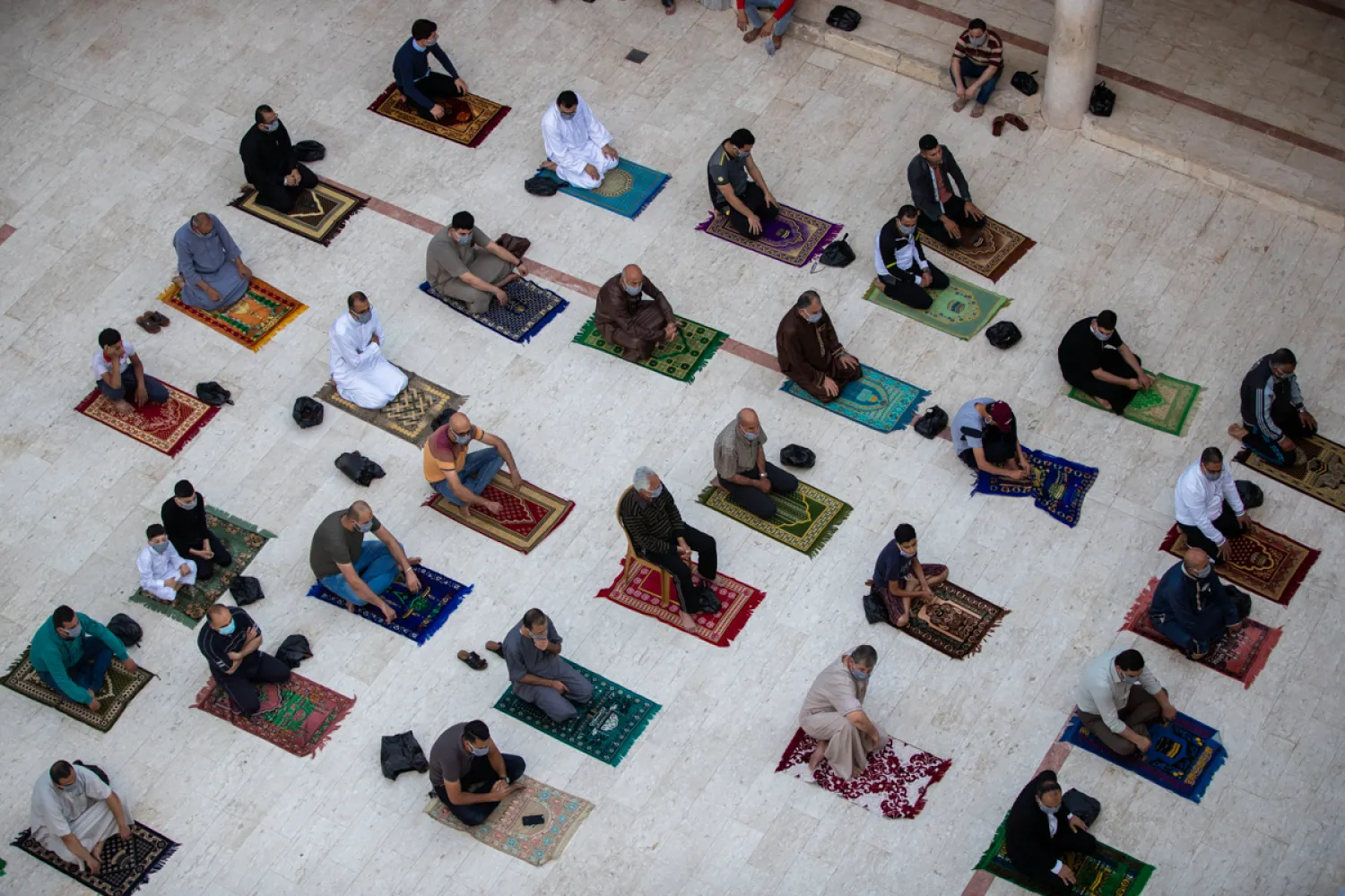 Palestinians attend Eid al-Fitr prayers outside a mosque in Gaza City. (AP)