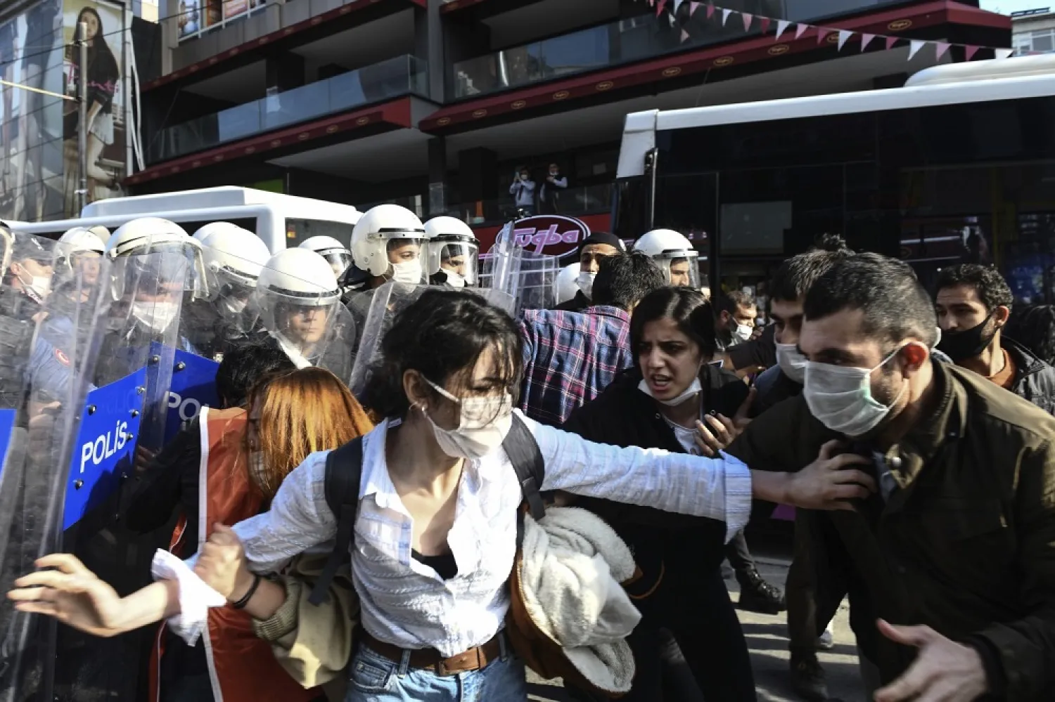 Turkish police officers, in riot gear, scuffle with protesters during a demonstration in Istanbul, Tuesday, June 2, 2020, against the recent killing of George Floyd in Minneapolis. (AP)