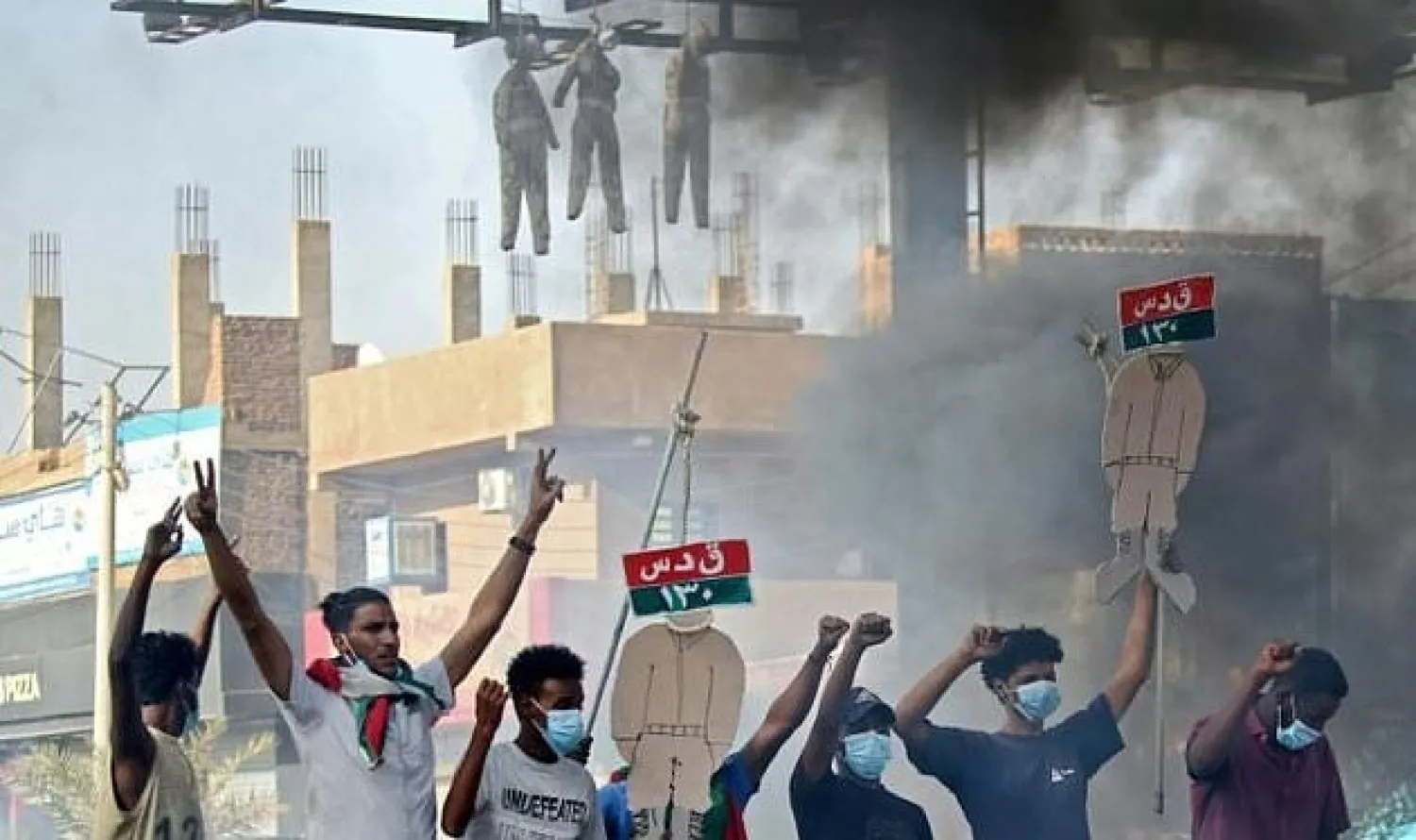 Sudanese protesters hang up effigies depicting Rapid Support Forces soldiers on the first anniversary of a deadly raid on an anti-government sit-in protest. AFP