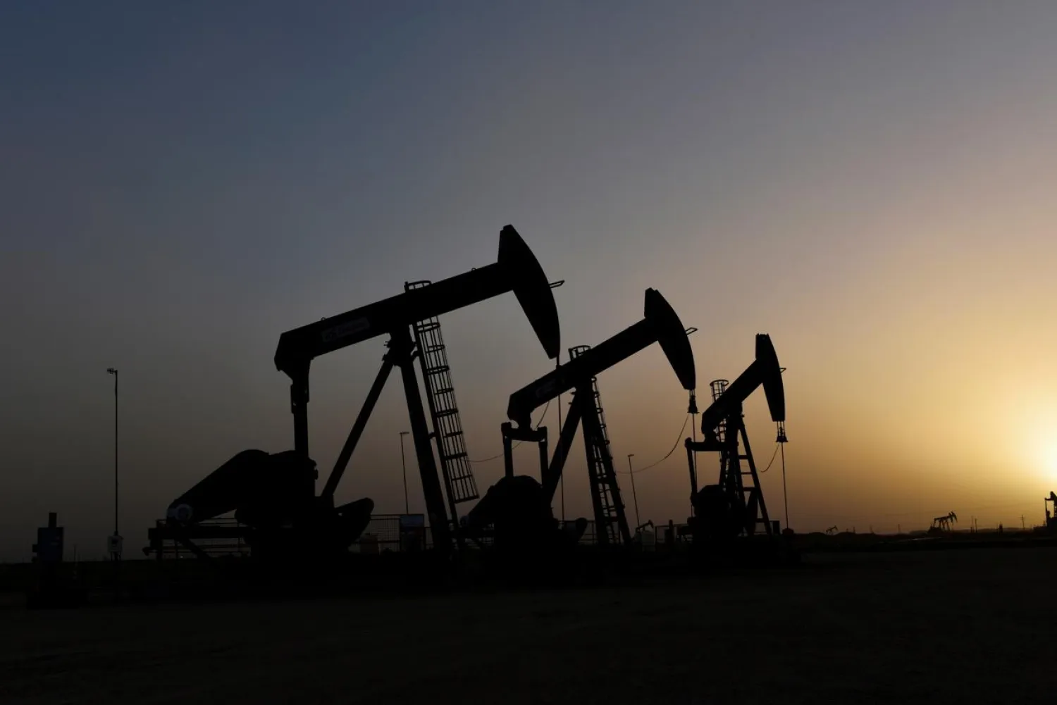 FILE PHOTO: Pump jacks operate at sunset in Midland, Texas, US, February 11, 2019. REUTERS/Nick Oxford