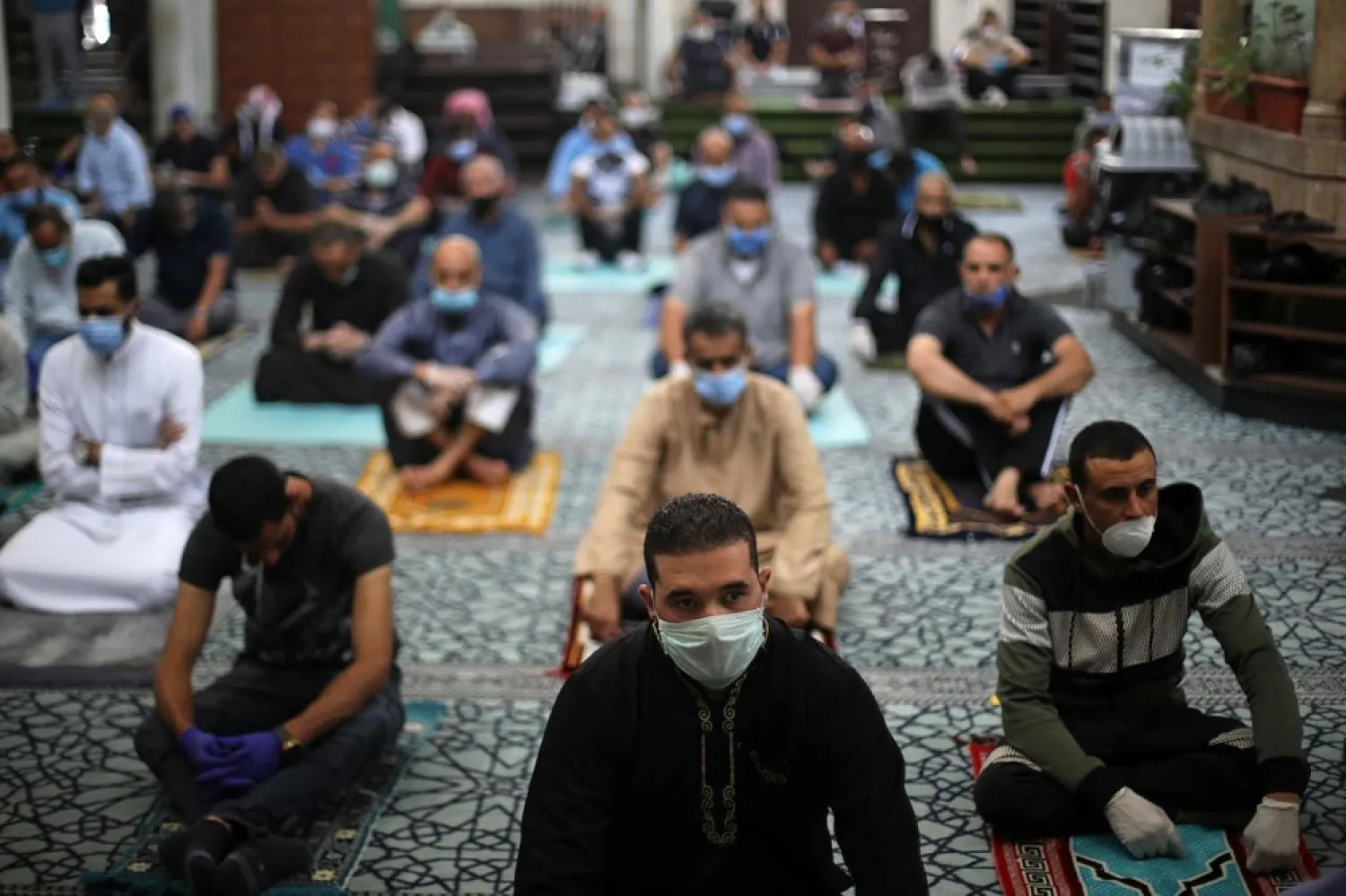 Worshippers attend prayers at a mosque for the first time after the closure of places of worship in Jordan for more than two months amid COVID-19 concerns, Amman, Jordan June 5, 2020. (Reuters)