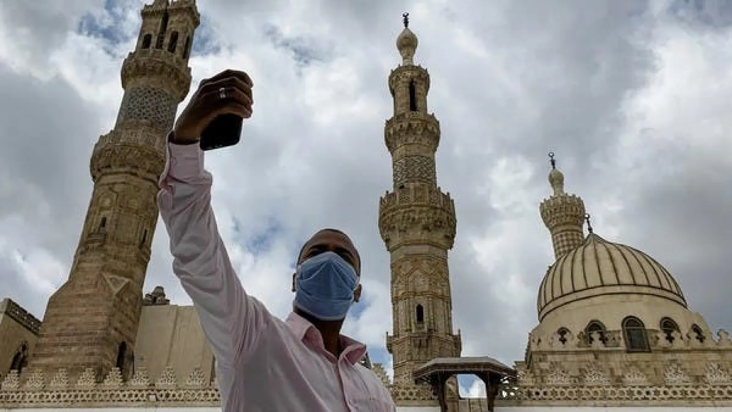 A man wearing a protective face mask takes a selfie photo by his mobile phone after attending the Friday prayers inside Al-Azhar mosque. Reuters file photo