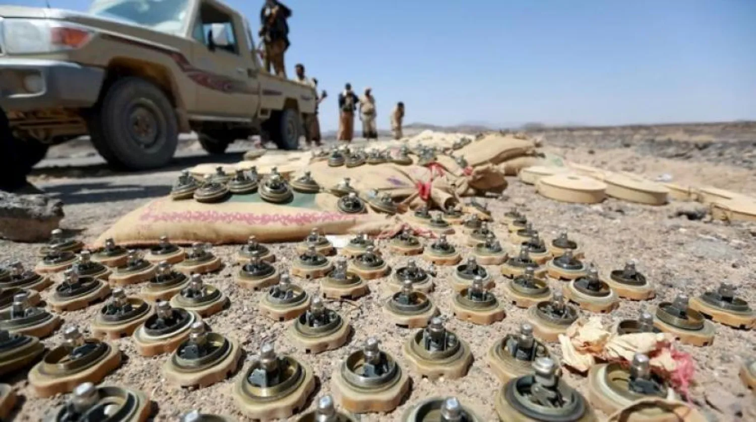 Soldiers loyal to Yemen's government stand next to mines planted by the Houthi group. (File photo: Reuters)
