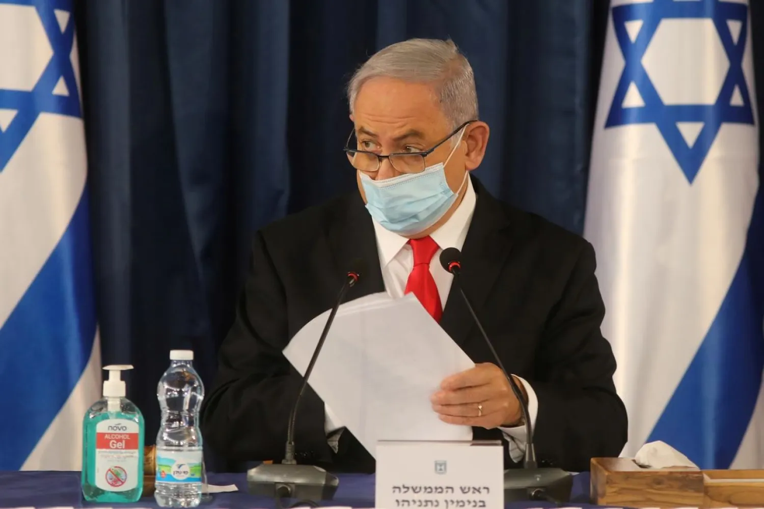 Israeli Prime Minister Benjamin Netanyahu, wearing a protective mask due to the ongoing coronavirus pandemic, chairs the weekly cabinet meeting in Jerusalem June 7, 2020. (Reuters)