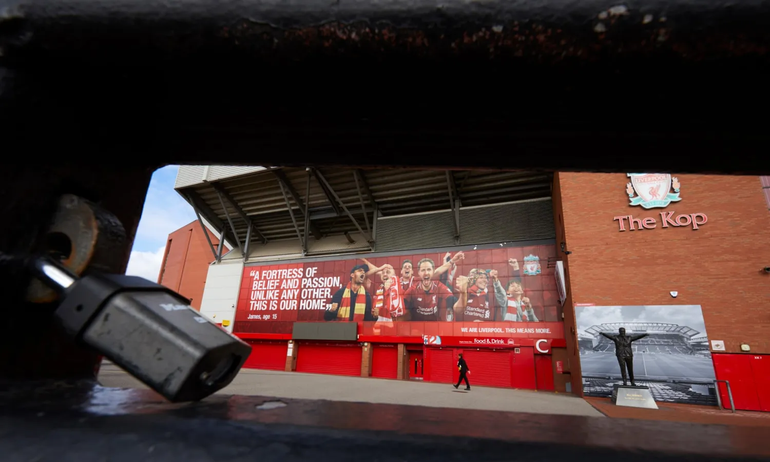 A locked gate outside the Kop at at Anfield. Photograph: Christopher Thomond/The Guardian