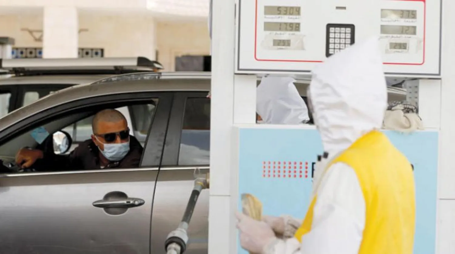 A car driver looks as he refuels his car at a petrol station amid a shortage of fuel supplies in Sanaa, Yemen June 10, 2020. REUTERS/Khaled Abdullah