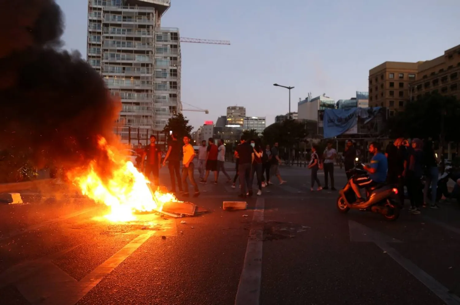 Demonstrators set fire during a protest against the collapsing Lebanese pound, in Beirut, Lebanon June 11, 2020. Reuters