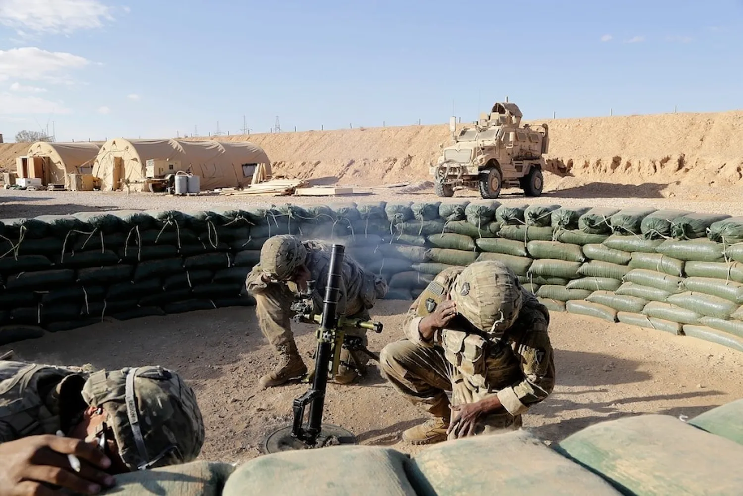 US soldiers conduct a mortar exercise at a small coalition outpost in western Iraq near the border with Syria on Jan. 24, 2018. (Susannah George/AP)