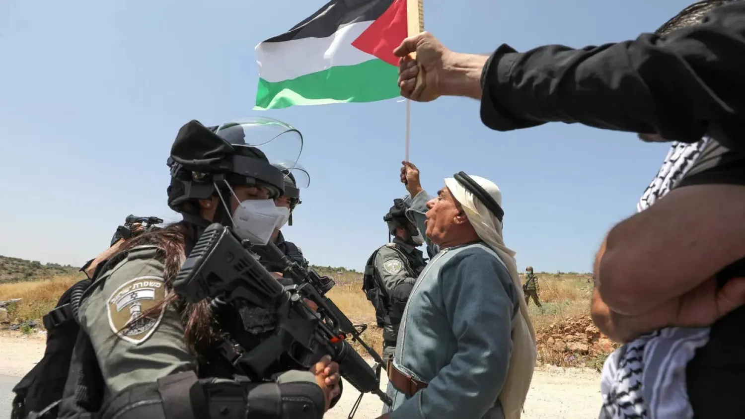 Demonstrators wave Palestinian flags and chant slogans against Israeli settlements and plans to annex part of the West Bank. (AFP)