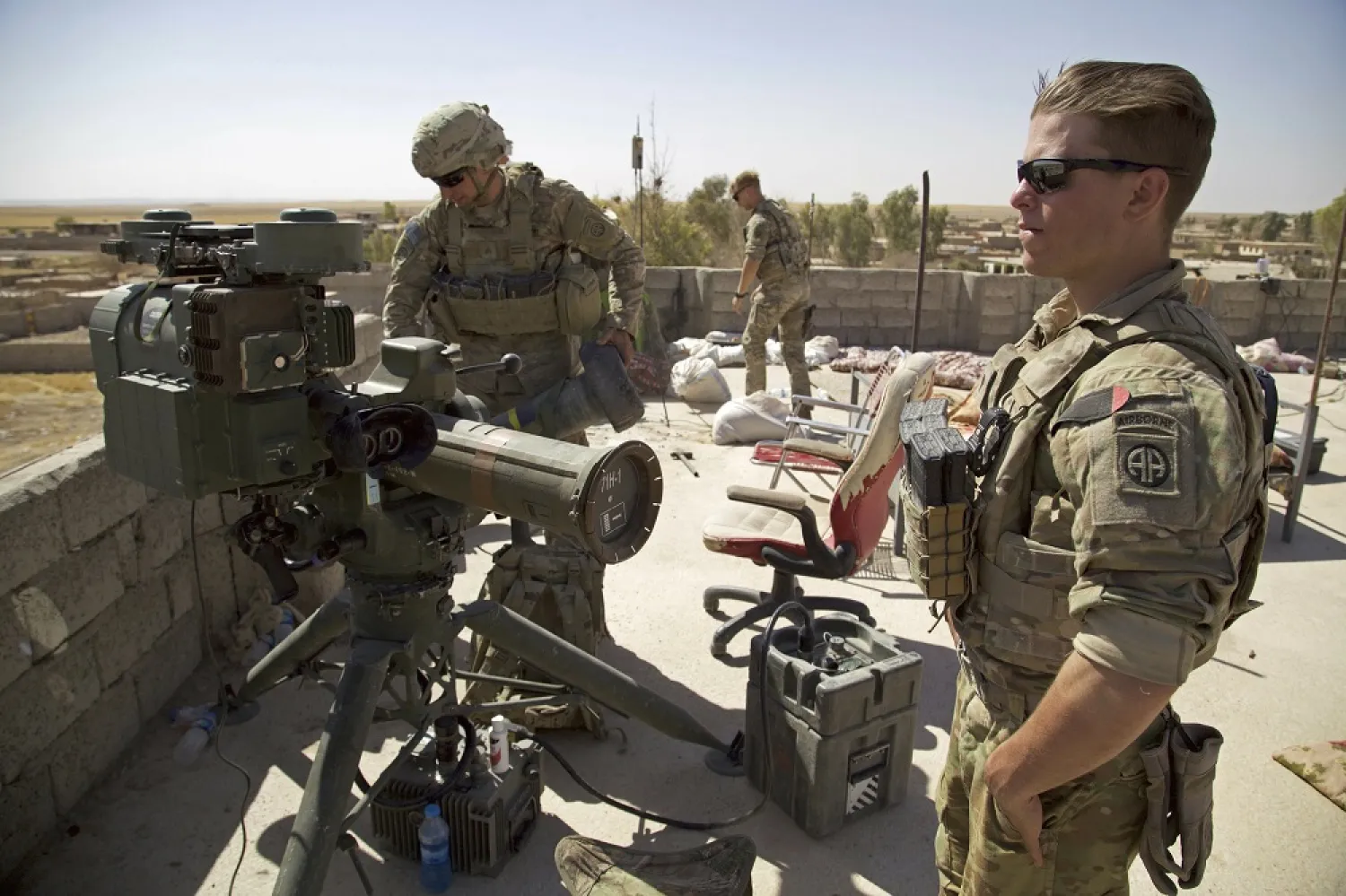 In this Aug. 20, 2017 file photo, US Army soldiers stands next to a guided-missile launcher in the village of Abu Ghaddur, east of Tal Afar, Iraq. (AP)