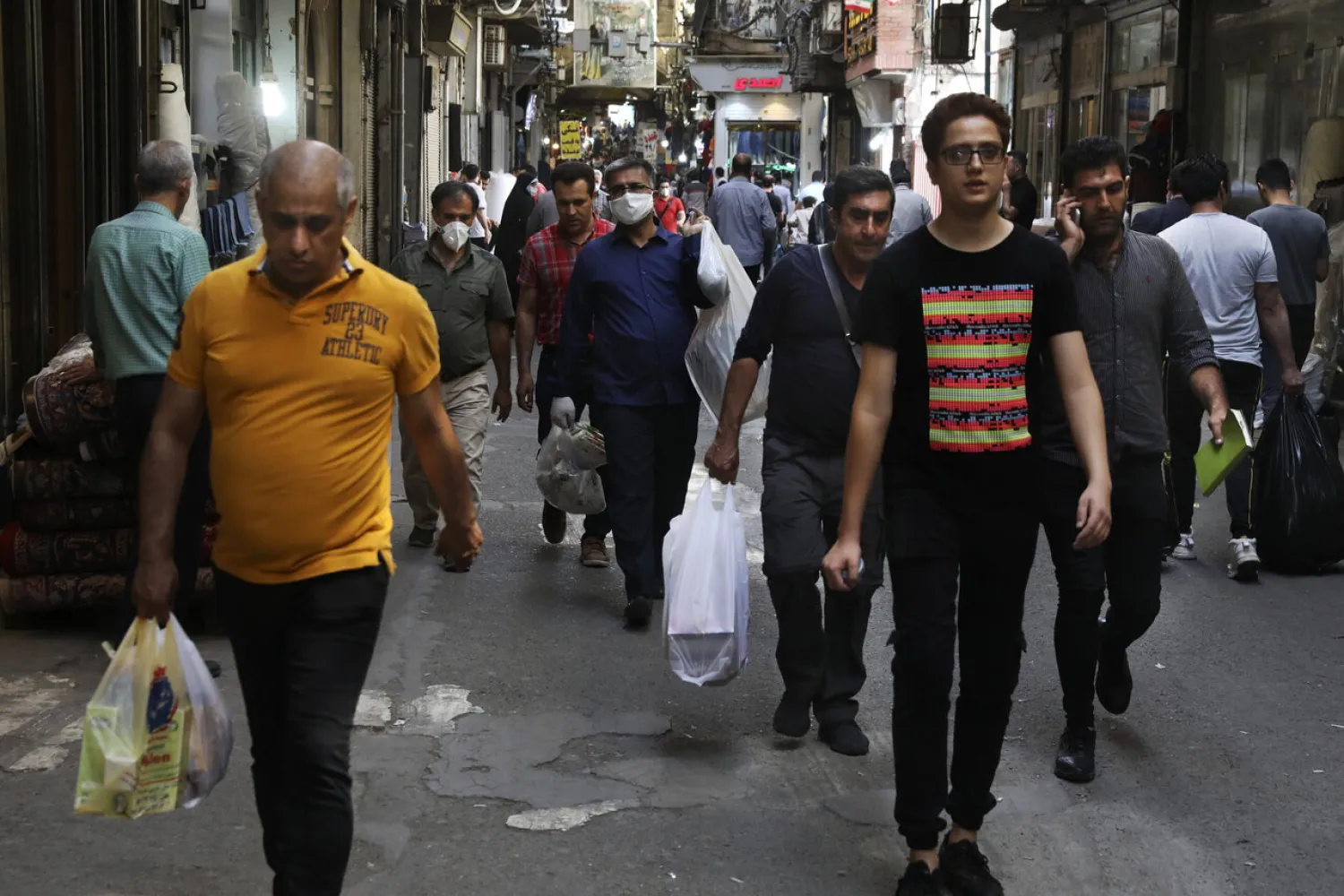 In this June 10, 2020, photo, people walk through Tehran's Grand Bazaar in Iran. (AP)