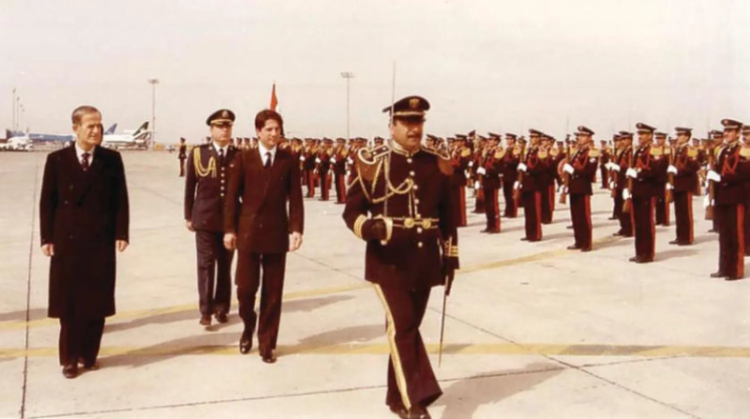 Syrian President Hafez Assad (L) sees of Lebanese President Amin Gemayel at Damascus airport.