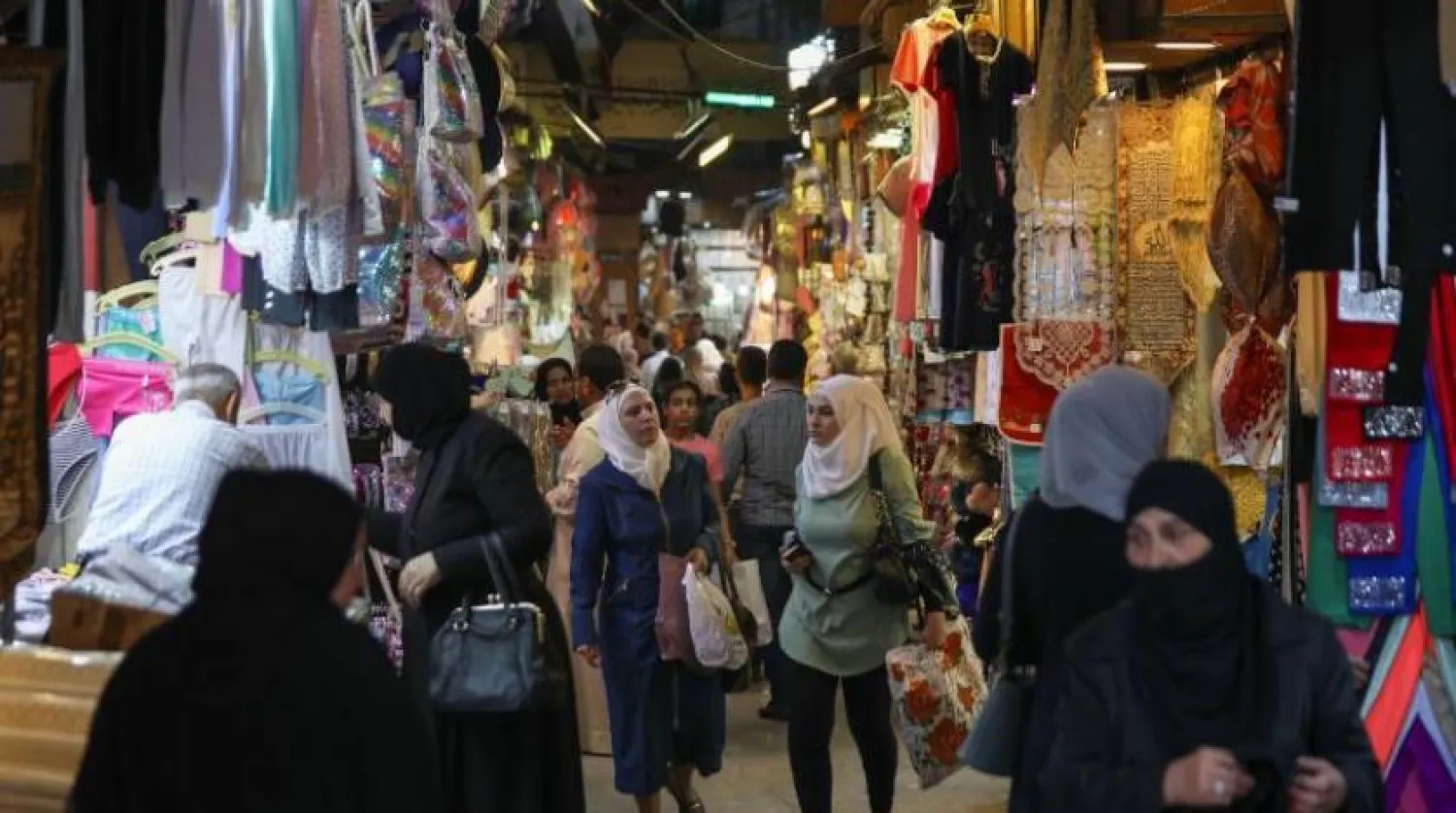 FILE: Syrians shopping in a Damascus markets. AFP