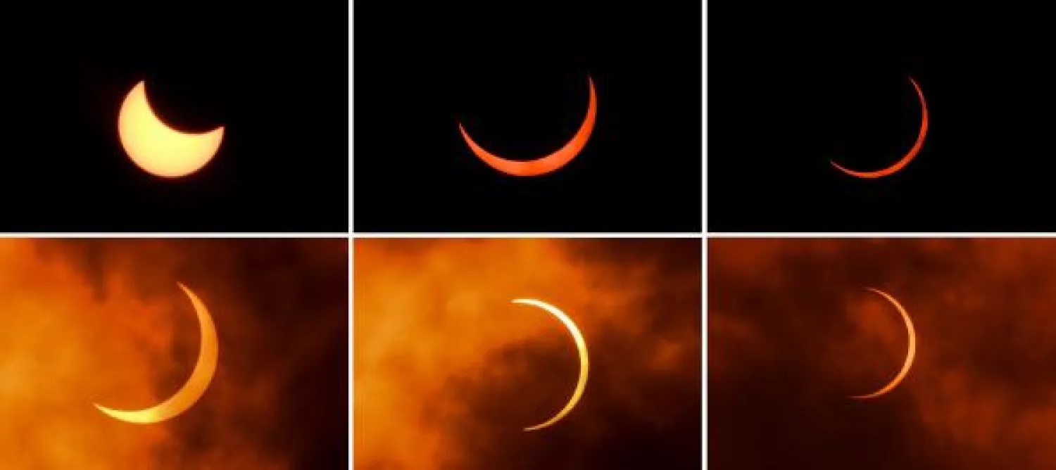 مراحل الكسوف الحلقي الشمسي كما يظهر من خلال السحب من نيودلهي (أ.ف.ب)