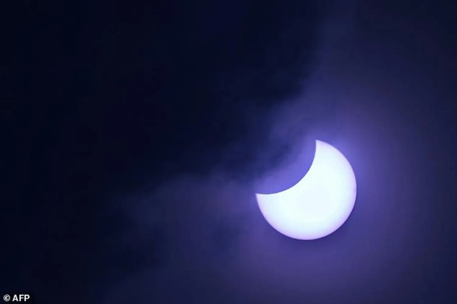 Annular eclipses occur when the Moon -- passing between Earth and the Sun -- is not quite close enough to our planet to completely obscure sunlight | AFP