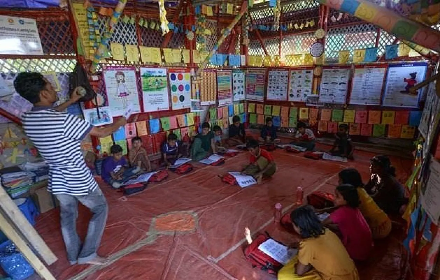 In Asia, displaced people such as the Rohingya are taught in separate systems, UNESCO said

