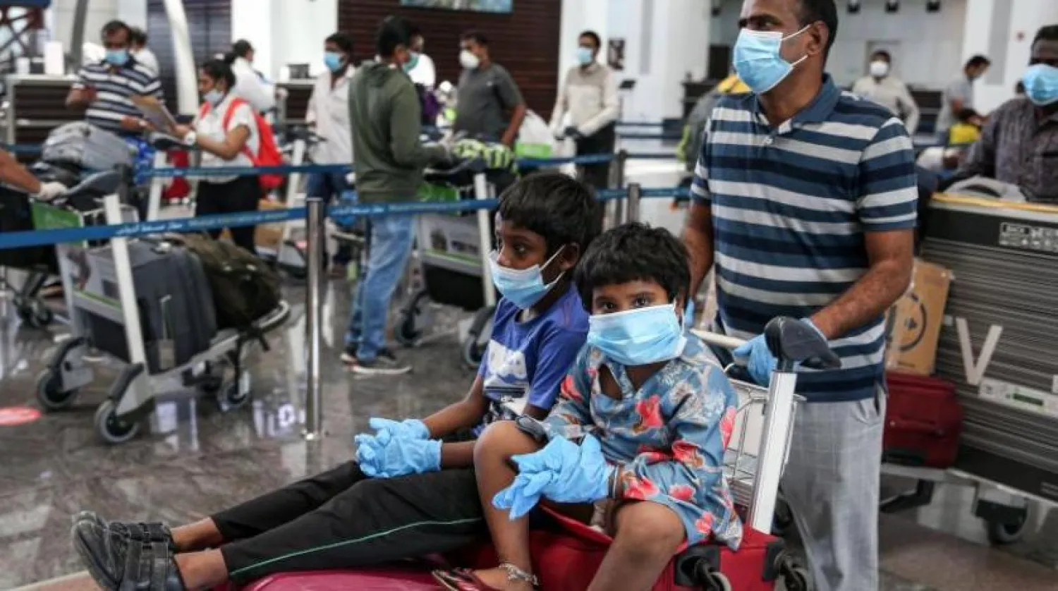 Travelers in Muscat's airport. AFP