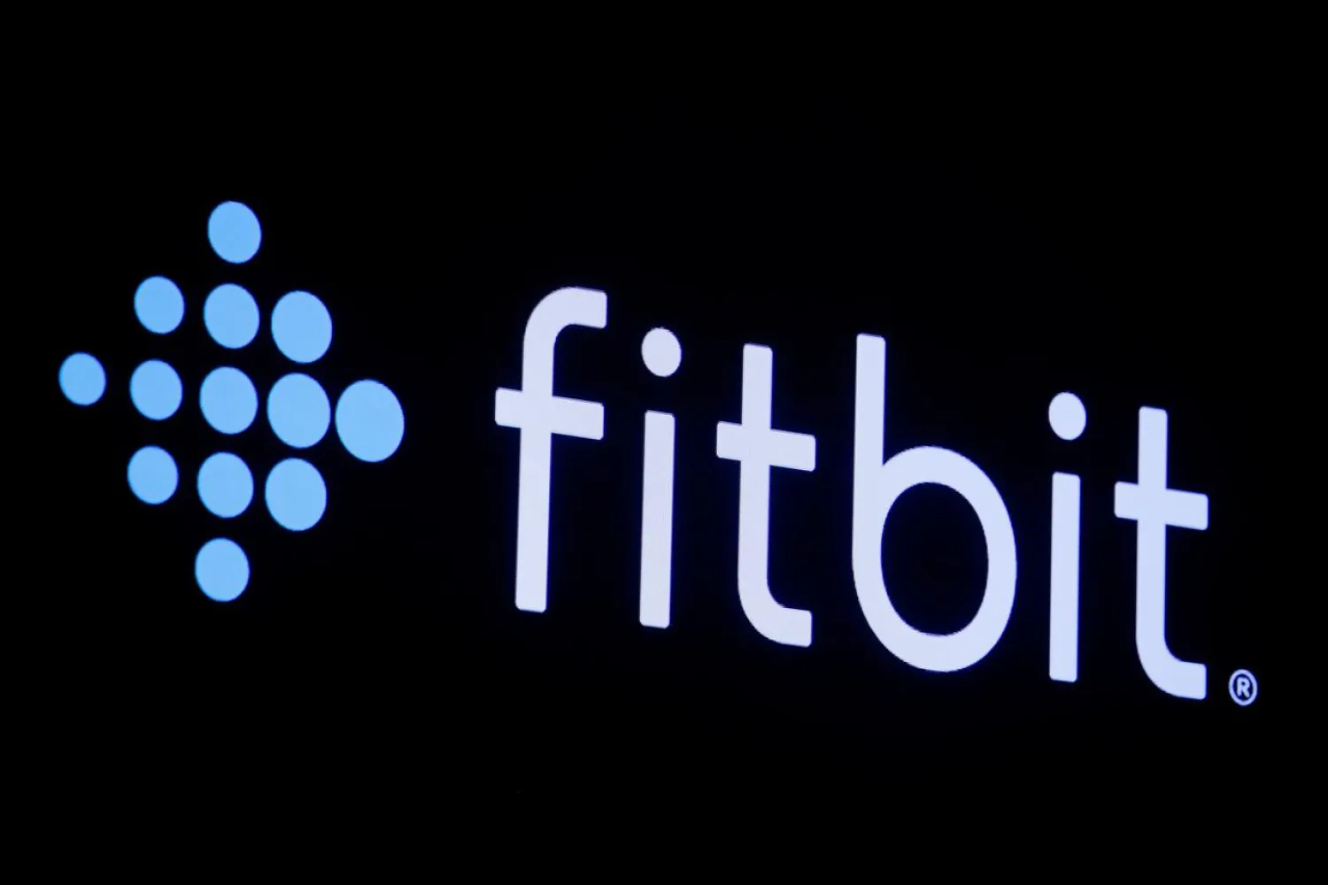 The logo for wearable device maker Fitbit Inc. is displayed on a screen on the floor of the New York Stock Exchange (NYSE) in New York, US, October 28, 2019. (Reuters)