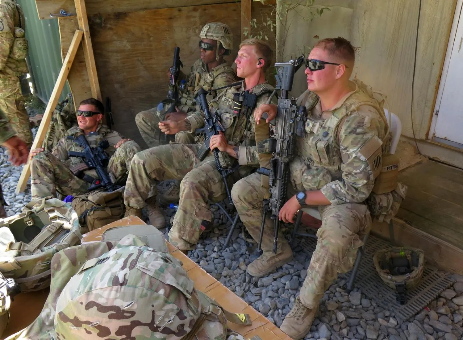 FILE PHOTO: US military advisers from the 1st Security Force Assistance Brigade sit at an Afghan National Army base in Maidan Wardak province, Afghanistan August 6, 2018. REUTERS/James Mackenzie/File Photo