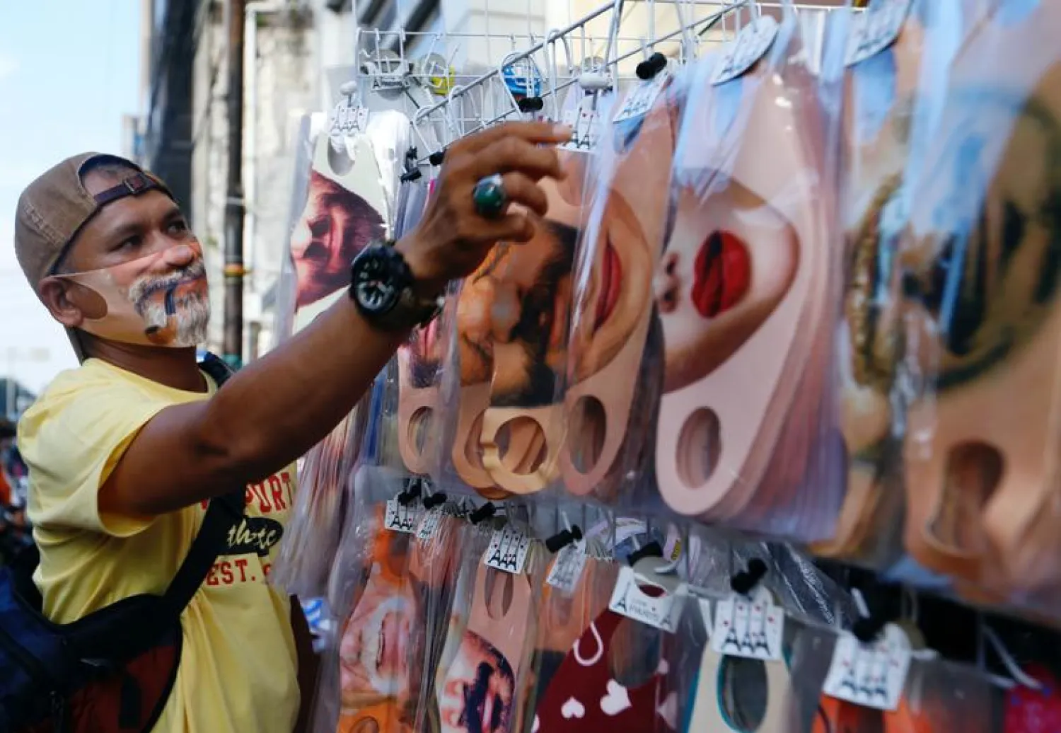 FILE PHOTO: A vendor sells face design masks at a traditional market to prevent the spread of the coronavirus disease (COVID-19) outbreak, in Jakarta, Indonesia June 23, 2020. REUTERS/Ajeng Dinar Ulfiana
