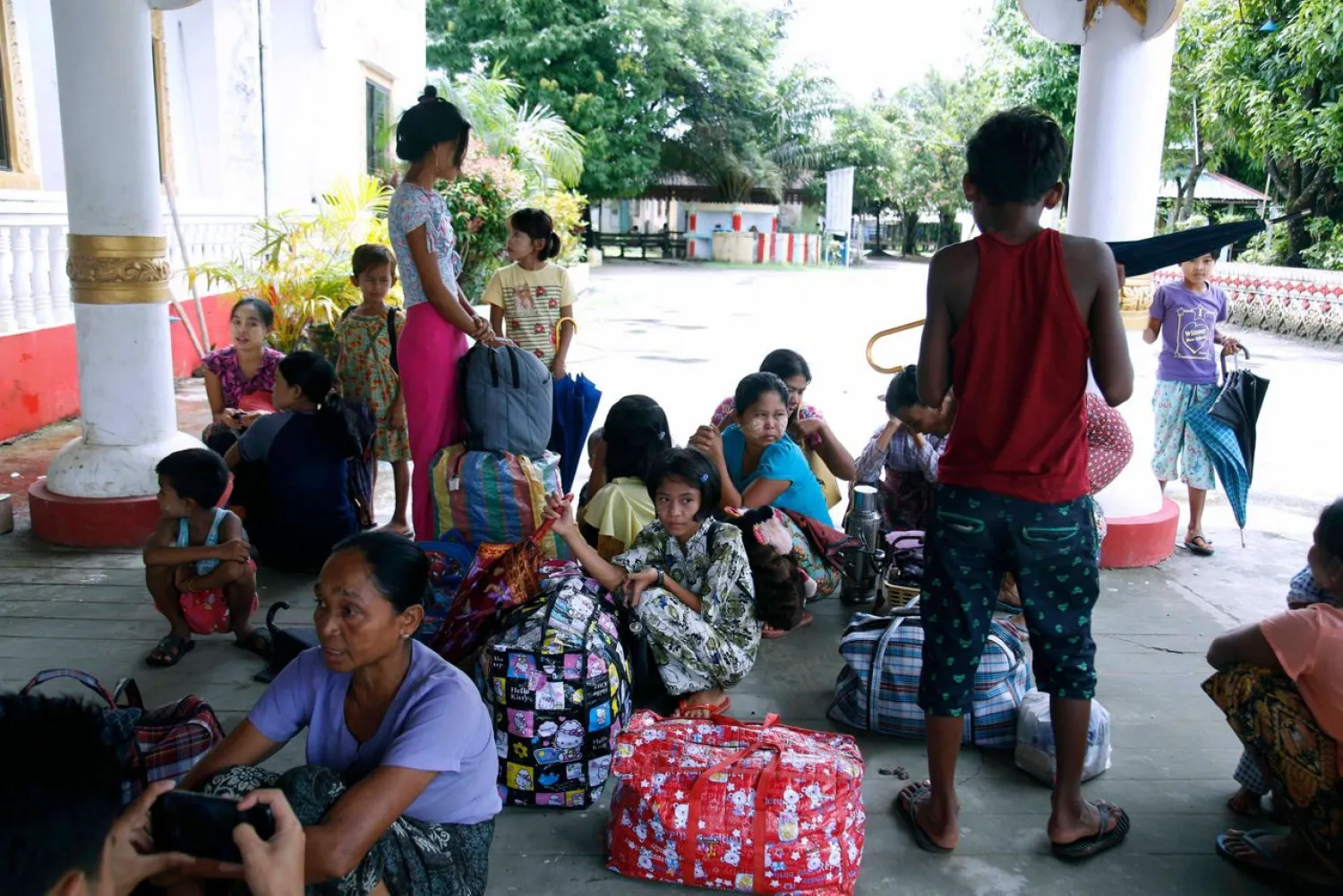 Ethnic Rakhine villagers arrive at a temporary monastery camp with their belongings, Monday, June 29, 2020, in Sittwe, Rakhine State, Myanmar. (AP Photo)