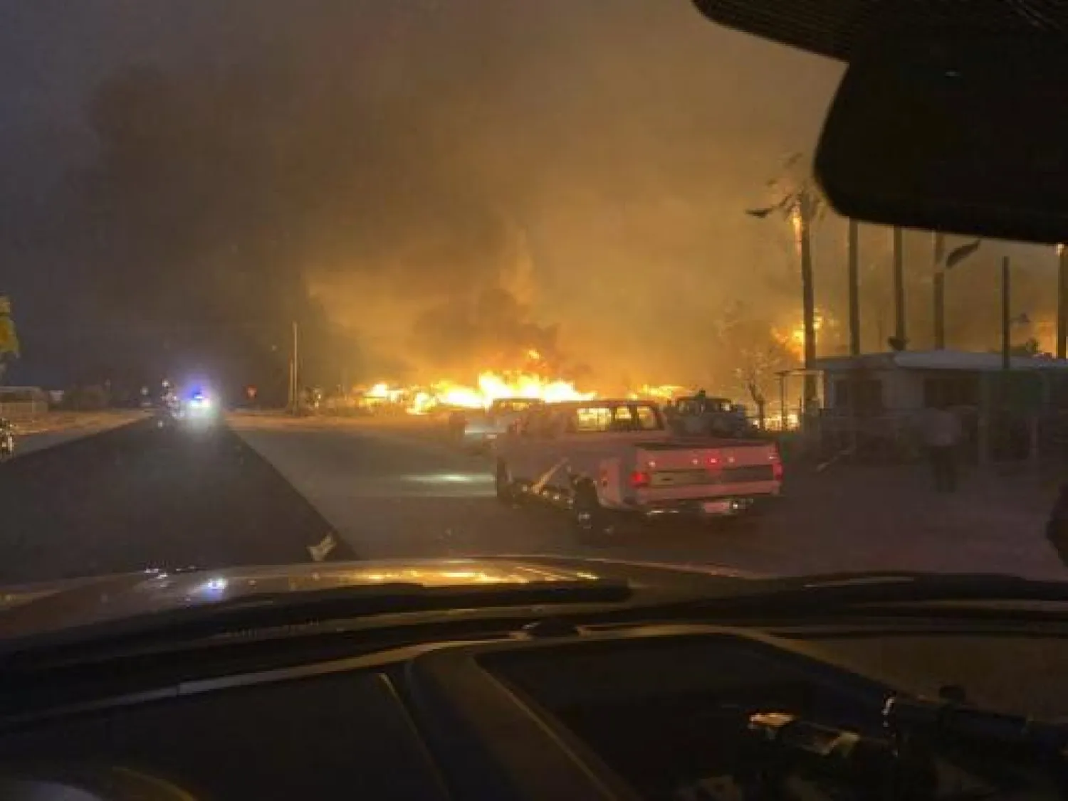 This Sunday, June 28, 2020 photo provided by El Centro Fire Department shows a wildfire burning through a section of Niland, Calif. AP