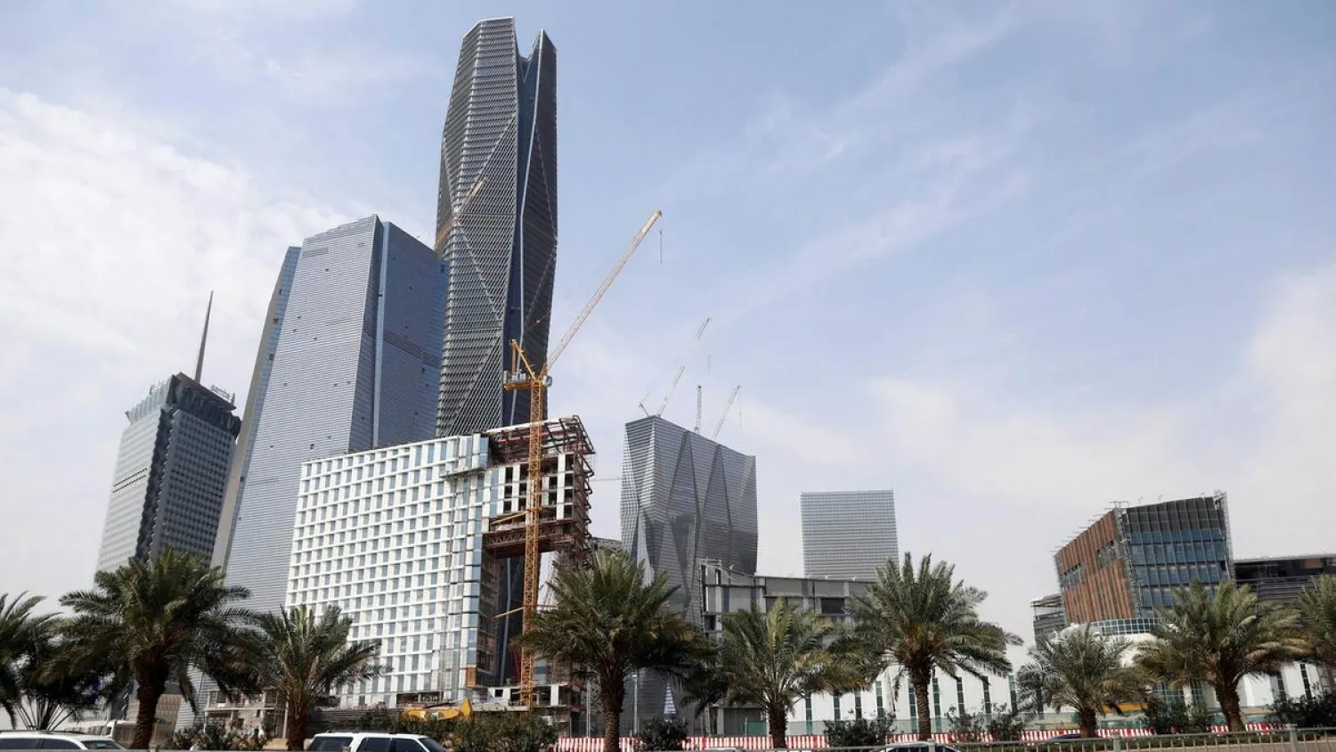 Cars drive past the King Abdullah Financial District, north of Riyadh. (Reuters)