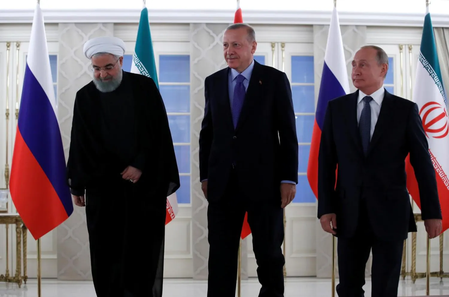 Presidents Hassan Rouhani of Iran, Recep Tayyip Erdogan of Turkey and Vladimir Putin of Russia walk before their meeting in Ankara, Turkey, September 16, 2019. (Reuters)