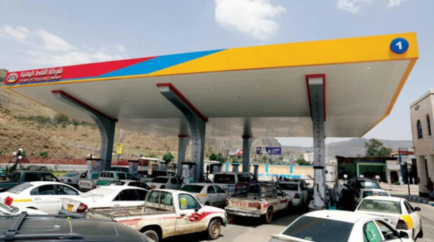 Car parks in front of a gas station in Sanaa (Reuters)
