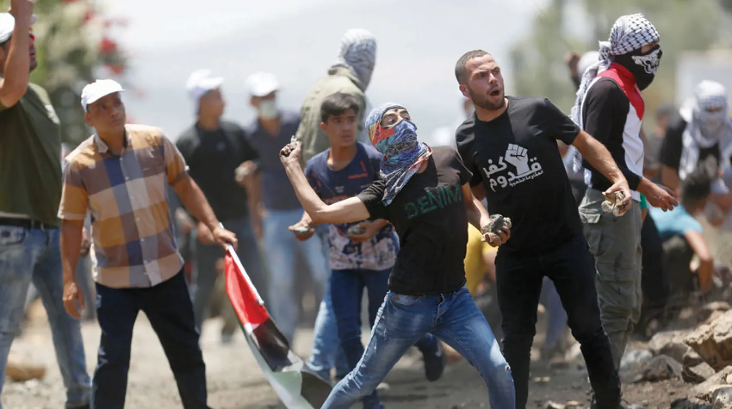 احتجاجات في كفر قدوم أمس ضد خطة إسرائيل لضم جزء من أراضي الضفة (أ.ب)