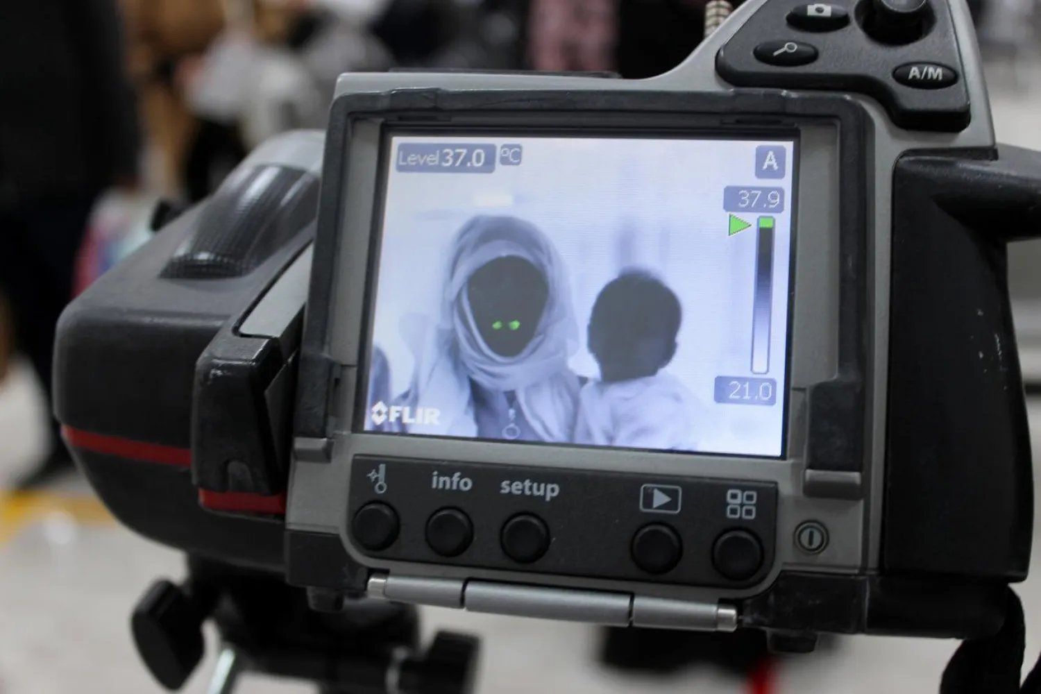 A screen shows passengers' temperature, as part of precautionary measures against coronavirus, at Misrata international Airport, in Misrata, Libya March 15, 2020. Picture taken March 15, 2020. REUTERS/Ayman Al-Sahili