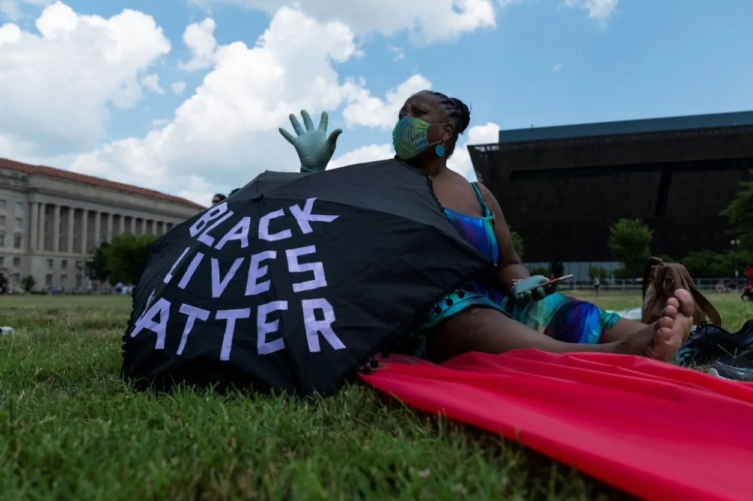 A Black Lives Matter supporter is seen in Washington on July 4 | AFP