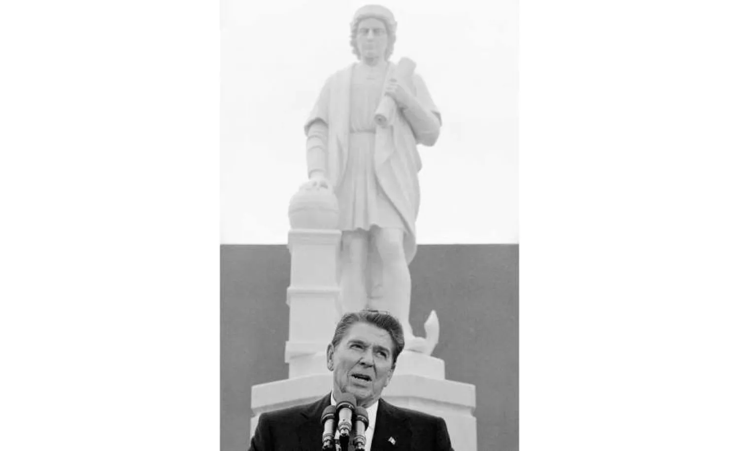 In this Monday, Oct. 9, 1984, file photo, President Ronald Reagan addresses a ceremony in Baltimore, to unveil a statue of Christopher Columbus. Baltimore protesters pulled down the statue of Christopher Columbus and threw it into the city's Inner Harbor, Saturday, July 4, 2020. (AP Photo/Lana Harris, File)