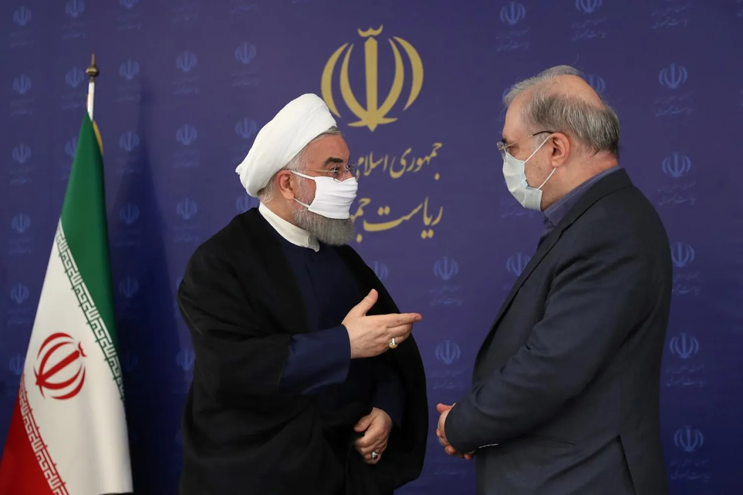 Iran's President Hassan Rouhani (L) has started wearing a mask in public as novel coronavirus cases have mounted | AFP