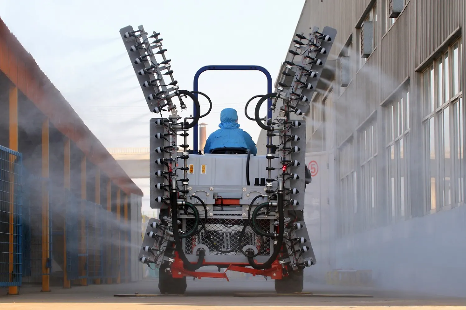 A worker operates a machine to spray disinfectants at an industrial park following an outbreak of the coronavirus in the country, in Yantai, Shandong province, China February 9, 2020. (Reuters)