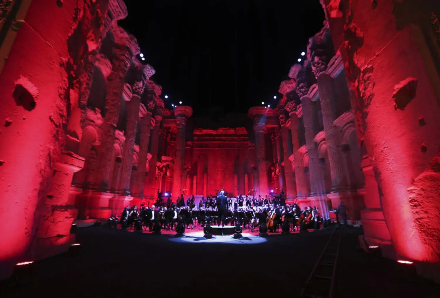 Maestro Harout Fazlian conducts rehearsals ahead of the Sound of Resilience concert inside the Temple of Bacchus at the historic site of Baalbek in Lebanon's eastern Bekaa Valley, on July 4, 2020. (Photo by AFP)