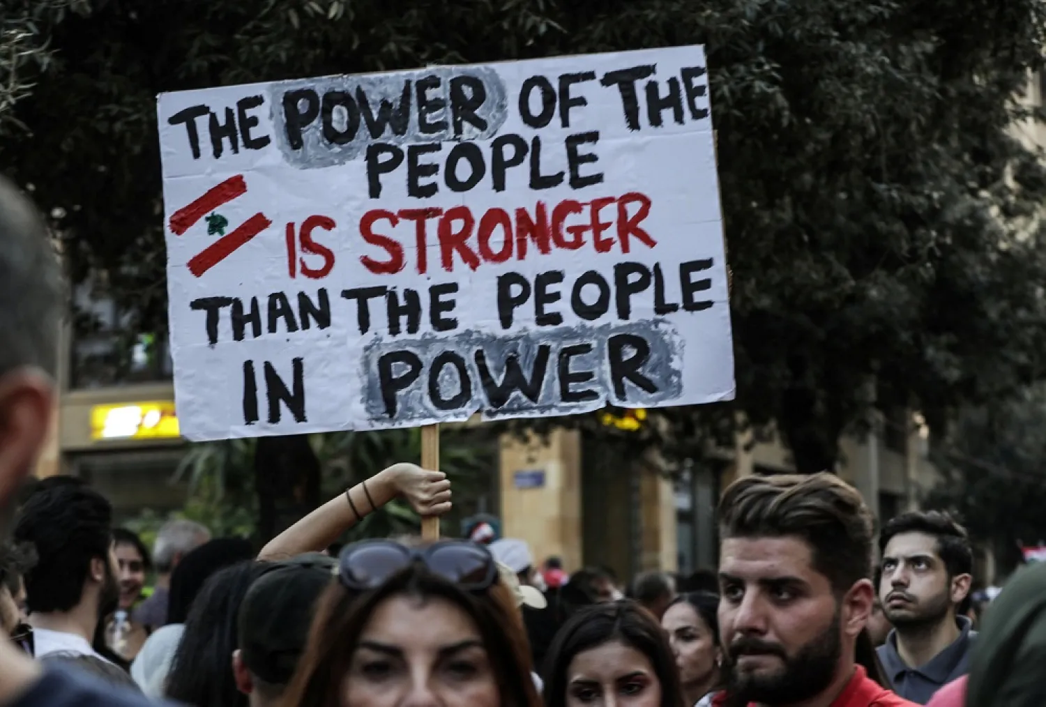Lebanese protesters carry a sign during a rally in downtown Beirut in October 2019. (AP)