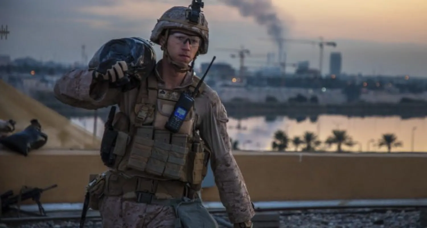 A US Marine carries a sandbag during the reinforcement of the US embassy compound in Baghdad, Jan. 4, 2020. (AP/US Marine Corps/Sgt. Kyle C. Talbot)