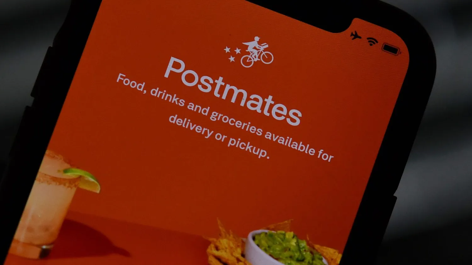 Uber agreed to buy the delivery app Postmates. AFP via Getty Images