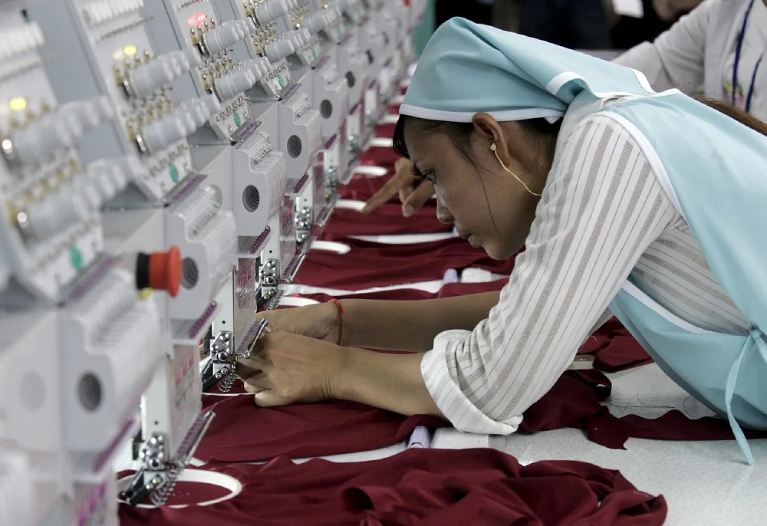 A woman works in a garment factory in the outskirts of Phnom Penh June 9, 2007. (Reuters)